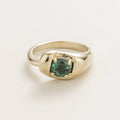 Juvetti white gold ring featuring a round lab-grown emerald in a bold contemporary setting.