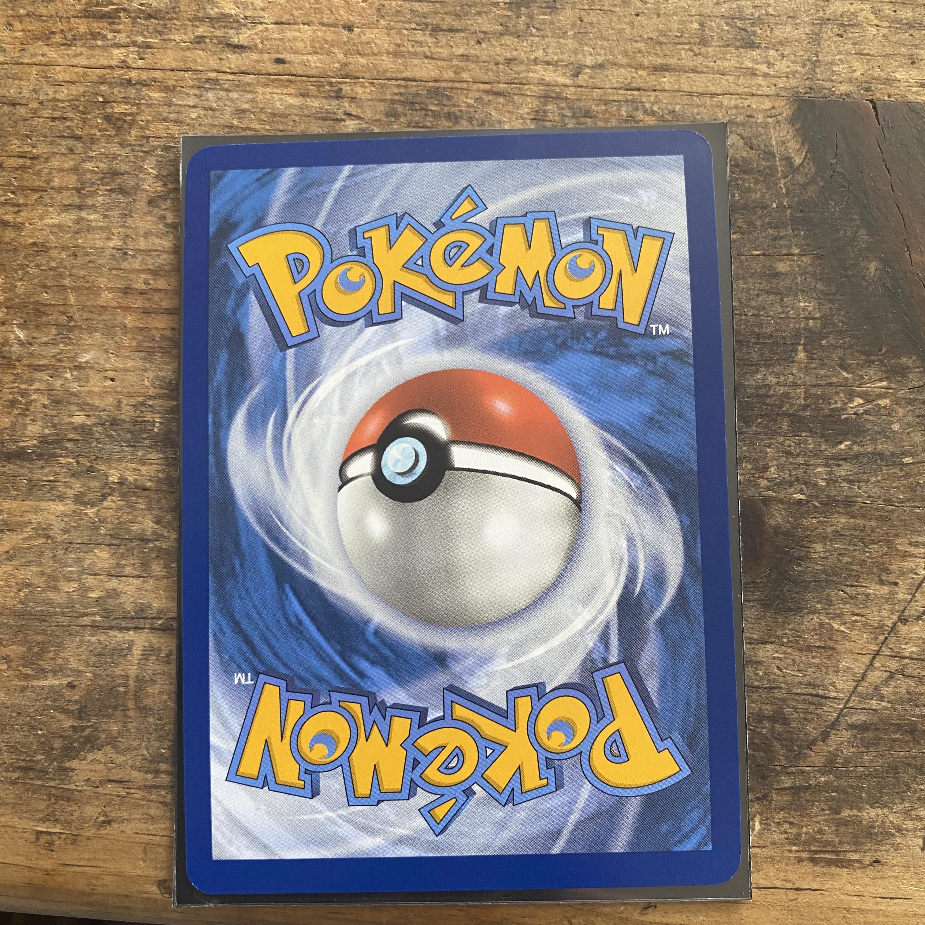 Anything I can do about the left edge here? Seems like a raised texture  layer? Would love to grade this but idk if it's worth it : r/PokeGrading